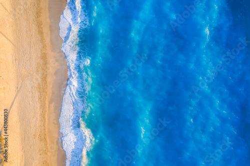 Aerial top down view of turquoise waters of Milos Beach, Lefkada island, Greece