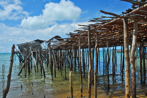 Broken hut on wooden pier, in Batam