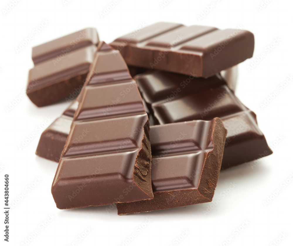 heap of pieces of chocolate isolated on white background