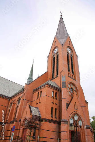 Our Saviour's Church, Haugesund, Norway. The church was designed by Architect Einar Halleland. The building is constructed in red brick new gothic style. The tower is 160 feet high. 