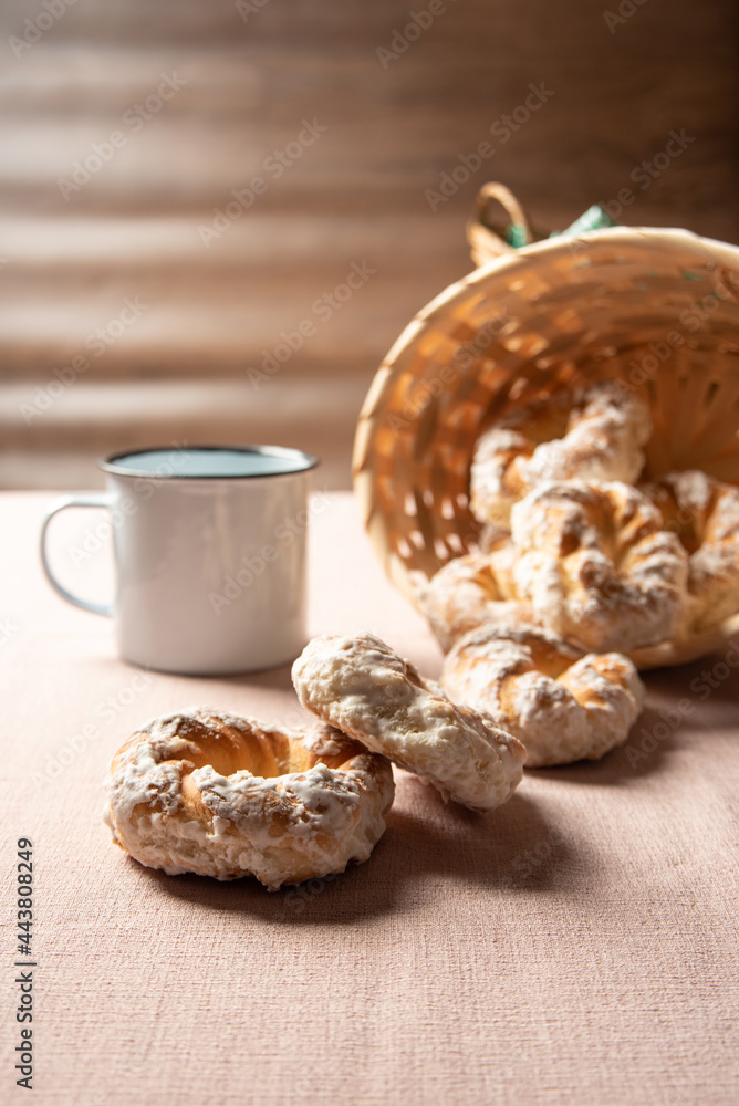 Brazilian sweet biscuit and a cup of coffee on a table with beige tablecloth, selective focus. Brazilian sweet biscuit and a cup of coffee on a table with beige tablecloth, selective focus.