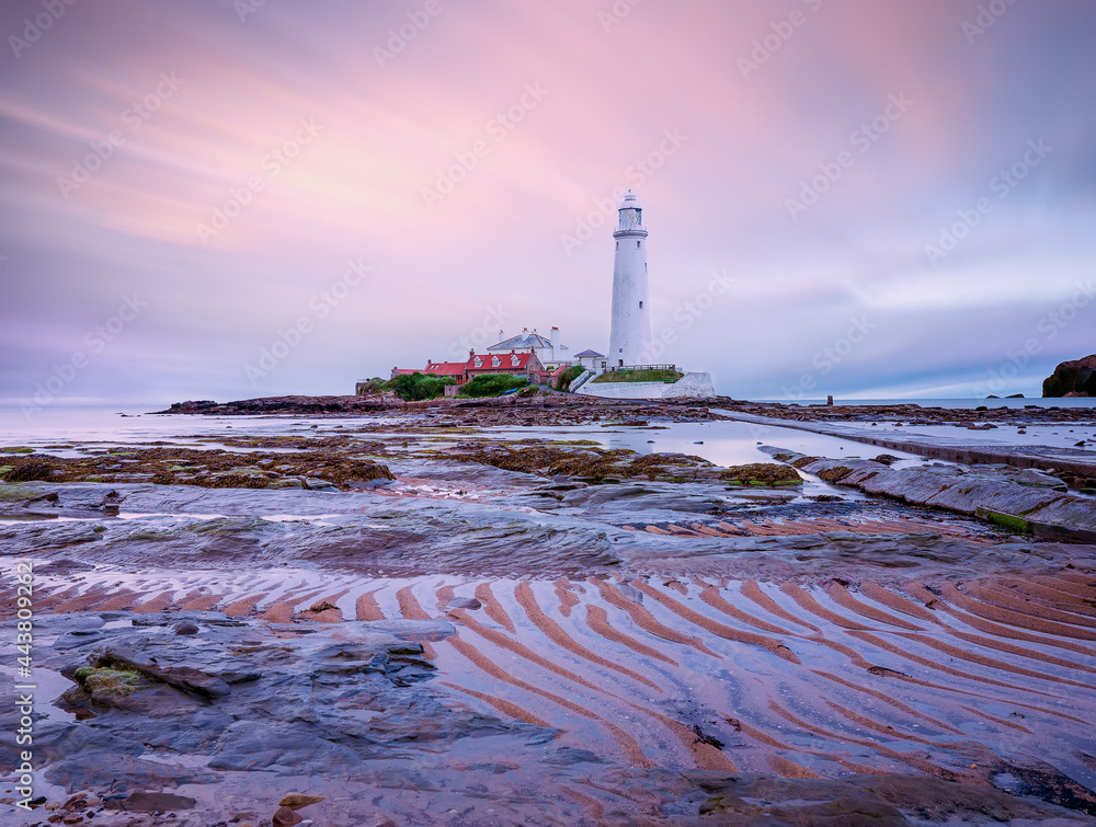 St. Mary's Lighthouse at sunset. Low tide time. Whitley Bay in Northumberland. England