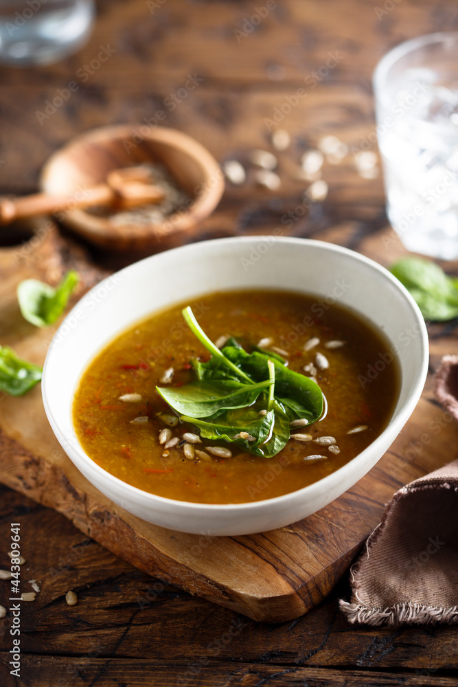 Homemade lentil soup with fresh spinach and seeds Homemade lentil soup with fresh spinach and seeds