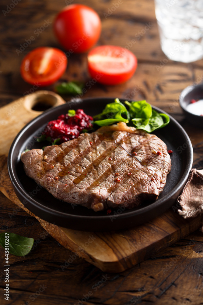 Grilled beef steak with fresh spinach Grilled beef steak with fresh spinach