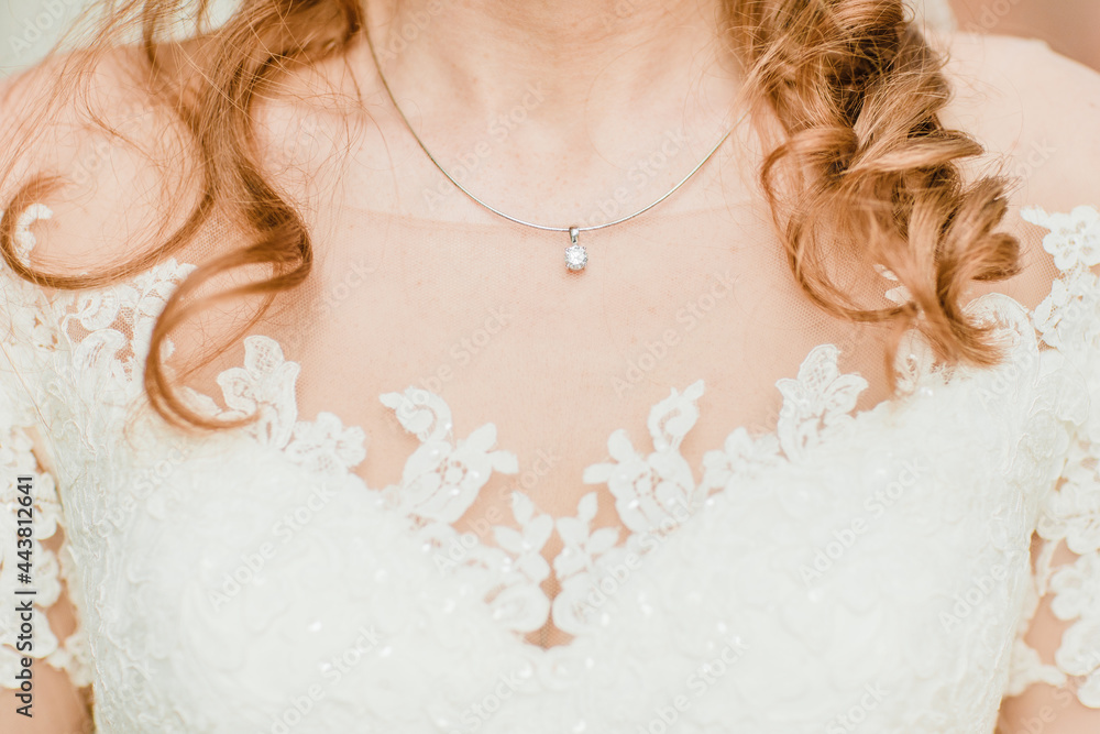 bride with dress. Beautiful necklace for a bride. Bridal jewelry 