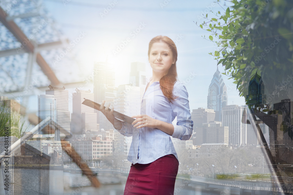Young businesswoman - skyscrapers on background 