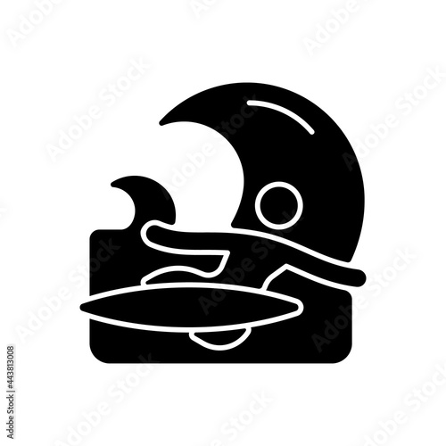 Backhand bottom turn in surfing black glyph icon. Performing fundamental manoeuvre. Surfer back facing wave. Backside turn. Silhouette symbol on white space. Vector isolated illustration