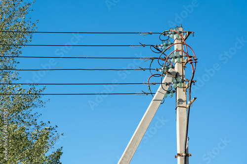 Concrete Power Line Post, underground power cable goes into overhead line. The first pillar in a chain of concrete supports