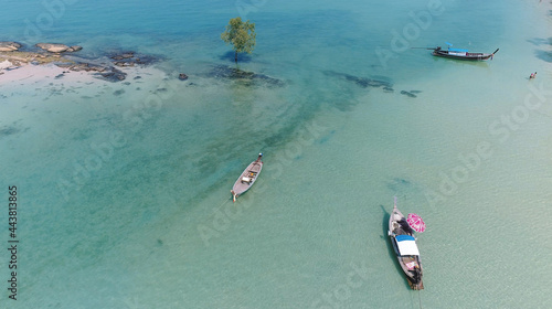 Top view or aerial view of Beautiful crystal clear water and white beach with long tail boats in summer of tropical island named Koh Lipe in Satun,Southern Thailand.