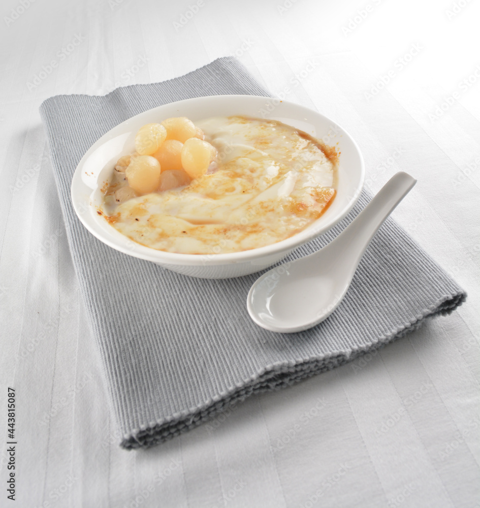 chilled soya bean curd tau hua with longan in brown sugar syrup asian cafe halal dessert restaurant pastry menu chilled soya bean curd tau hua with longan in brown sugar syrup asian cafe halal dessert restaurant pastry menu