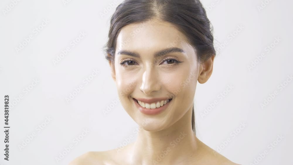 Portrait of Beautiful Woman at White Background. She looking to Camera with Attractive Smiling. Portrait of Beautiful Woman at White Background. She looking to Camera with Attractive Smiling.