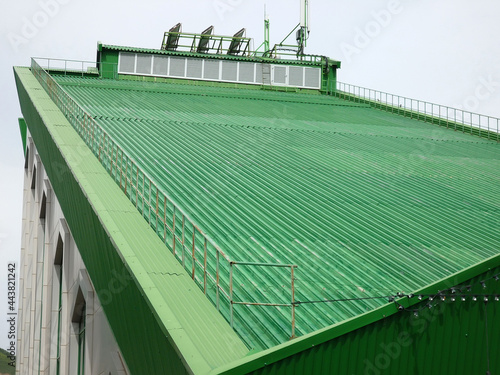 Wallpaper Mural Sloping green roof of the building with a mobile communication antenna Torontodigital.ca