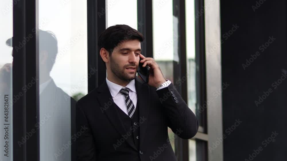 Handsome businessman using a mobile phone. Young man texting Messages, Social Networking. People. Apps. Handsome businessman using a mobile phone. Young man texting Messages, Social Networking. People. Apps.
