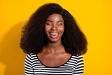 Photo portrait of young model laughing dreamy with closed eyes isolated on vivid yellow color background
