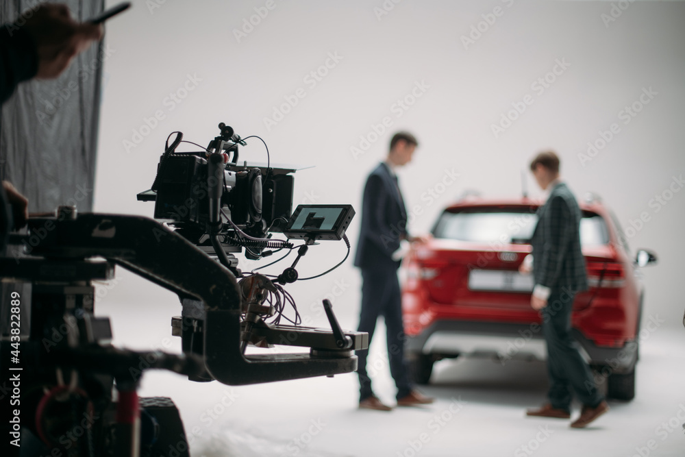 Professional cinema and video camera on the set. Shooting shift, lighting fixtures, shooting equipment and the team. Professional cinema and video camera on the set. Shooting shift, lighting fixtures, shooting equipment and the team.