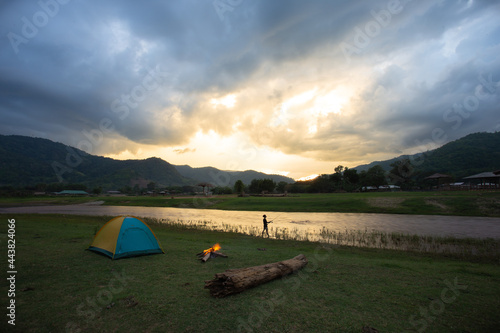 river landscape Green meadows, mountains, sky, rain clouds, riverside bonfires to relax in this area. Suitable for holidays in Thailand
