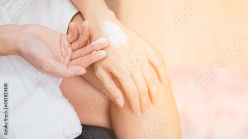 Woman applying natural cream, Woman moisturizing her hand with cosmetic cream, Spa and Manicure concept.