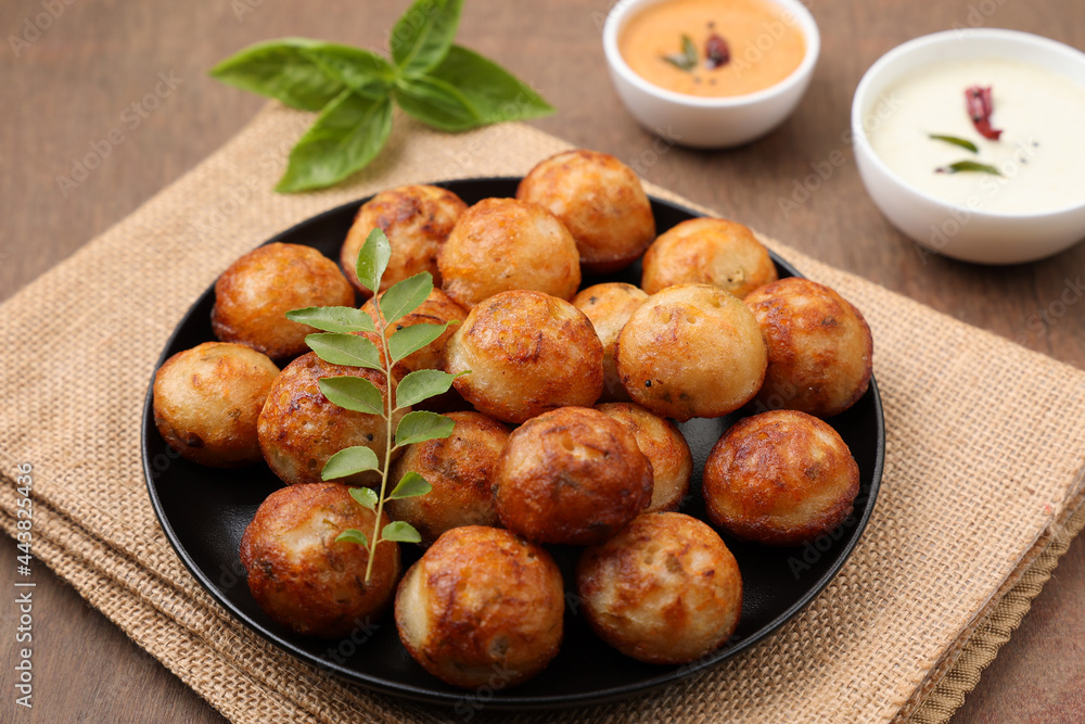 Paniyaram, Kuzhi paniyaram Gunta ponganalu paddu, guliyappa made of black lentils and rice deep fried snack or breakfast vegan vegetarian South Indian Kerala Tamil Nadu Karnataka Sri Lanka Lankan food Paniyaram, Kuzhi paniyaram Gunta ponganalu paddu, guliyappa made of black lentils and rice deep fried snack or breakfast vegan vegetarian South Indian Kerala Tamil Nadu Karnataka Sri Lanka Lankan food