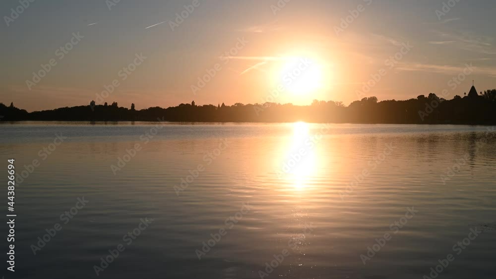 Sunset above the lake. Beautiful lake Palic near Subotica at evening. Sunset above the lake. Beautiful lake Palic near Subotica at evening.