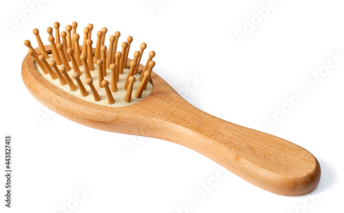 one wooden paddle hairbrush isolated on white