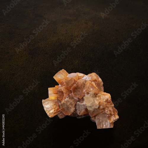 aragonite gemstone on leather background photo