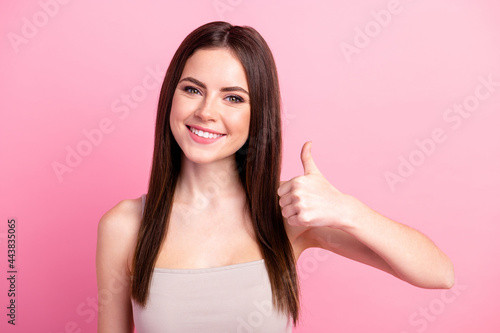 Photo of young attractive girl happy positive smile show thumb-up like cool advert advice isolated over pink color background