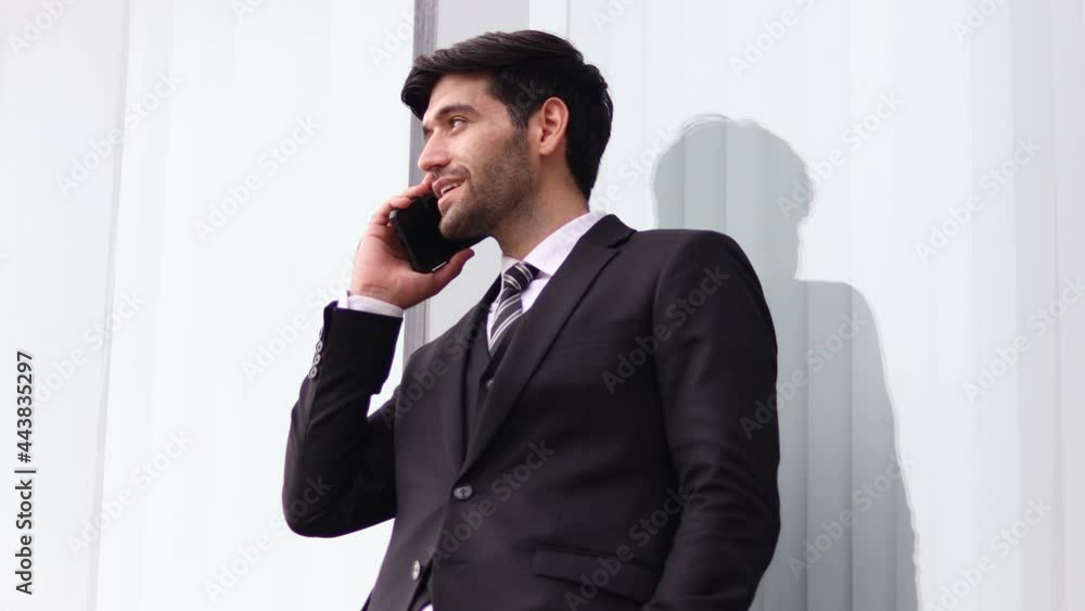 Handsome businessman using a mobile phone. Young man texting Messages, Social Networking. People. Apps. Handsome businessman using a mobile phone. Young man texting Messages, Social Networking. People. Apps.
