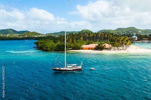 Sailing boat enters the bay of Martinique French Polynesia.