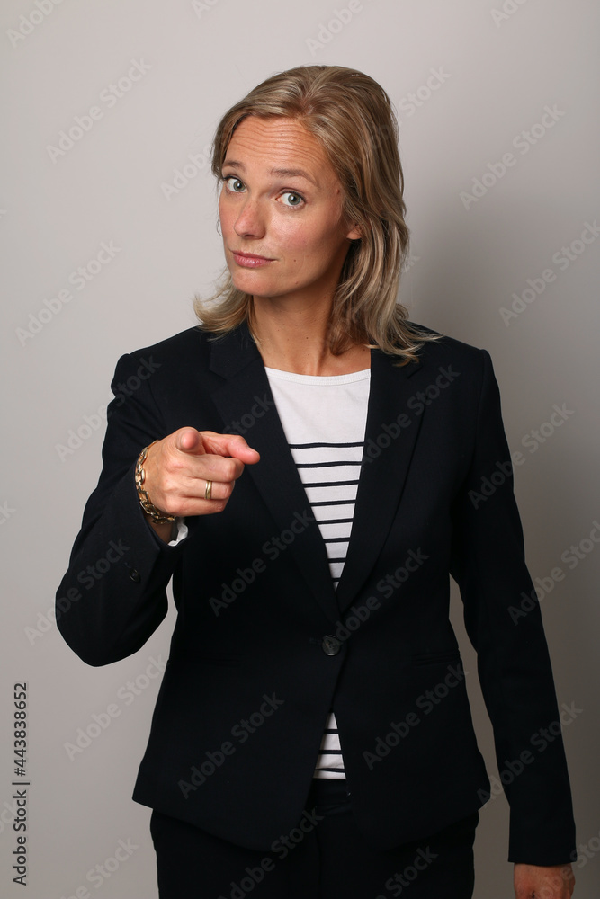 Beautiful happy commercial woman in front of a colored background Beautiful happy commercial woman in front of a colored background