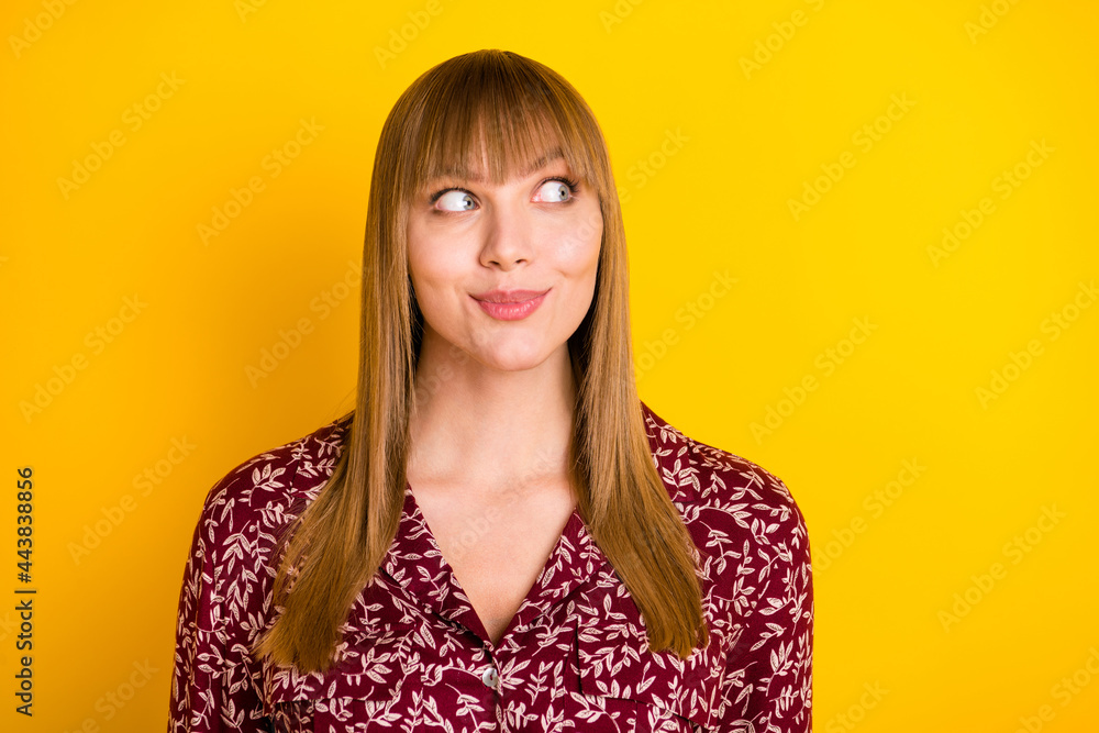 Photo of young beautiful woman happy positive smile dream dreamy look empty space isolated over yellow color background Photo of young beautiful woman happy positive smile dream dreamy look empty space isolated over yellow color background