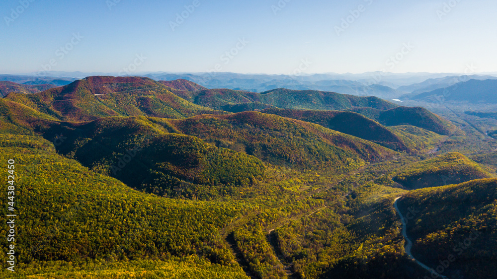 View from above. Low autumn mountains of Primorskaya taiga.