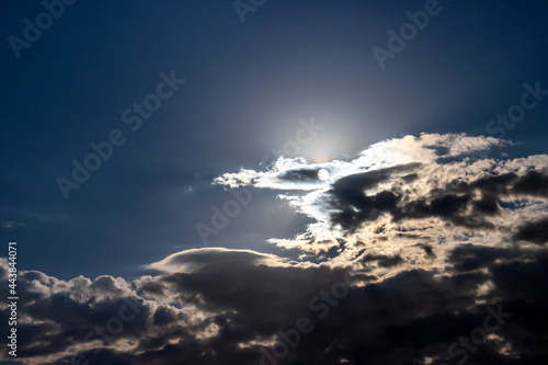 Light and dark clouds and rays of the sun shine through the clouds, a beautiful abstract landscape