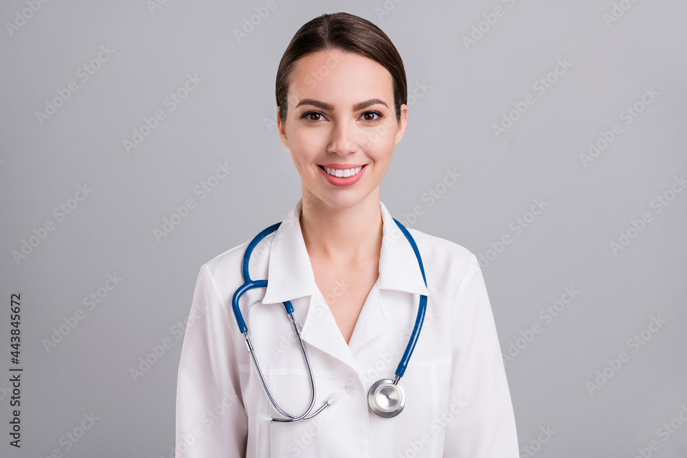 Photo of charming good mood young lady doctor workwear smiling isolated grey color background Photo of charming good mood young lady doctor workwear smiling isolated grey color background