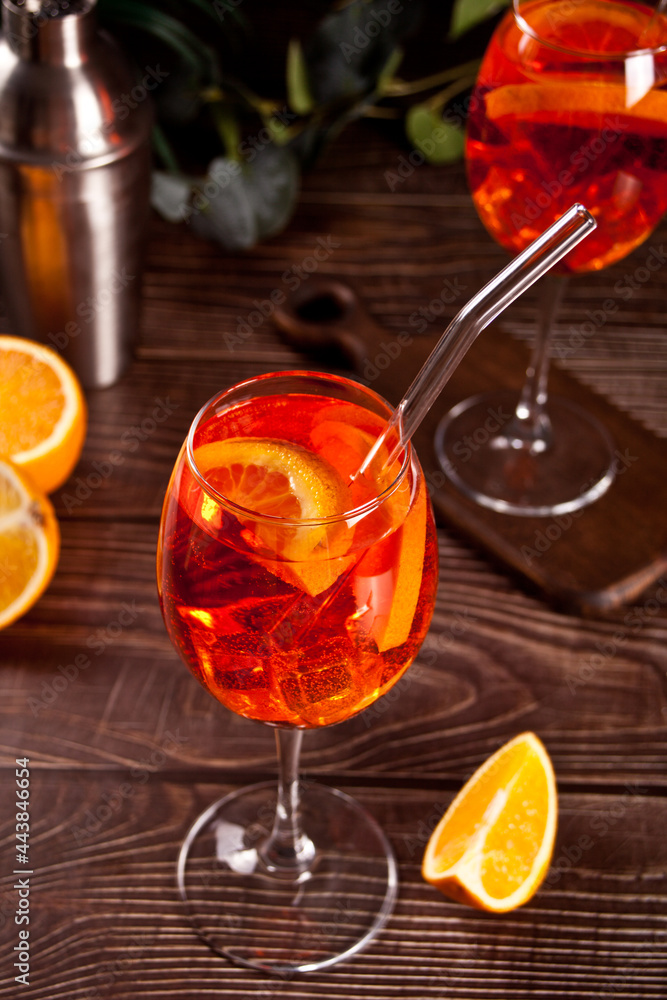 Aperol Spritz Italian cocktail alcoholic beverage with ice cubes and oranges. Aperol Spritz Italian cocktail alcoholic beverage with ice cubes and oranges.