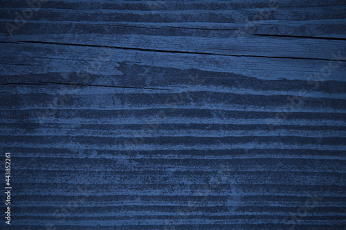 Old dark blue wood board. Close-up. Background. Texture.