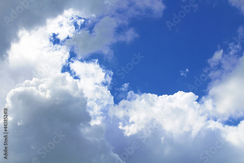 Beautiful blue sky and large white cumulus clouds. Background. Scenery. Texture.