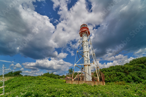 Lighthouse Under a Deep Blue Sky. photo