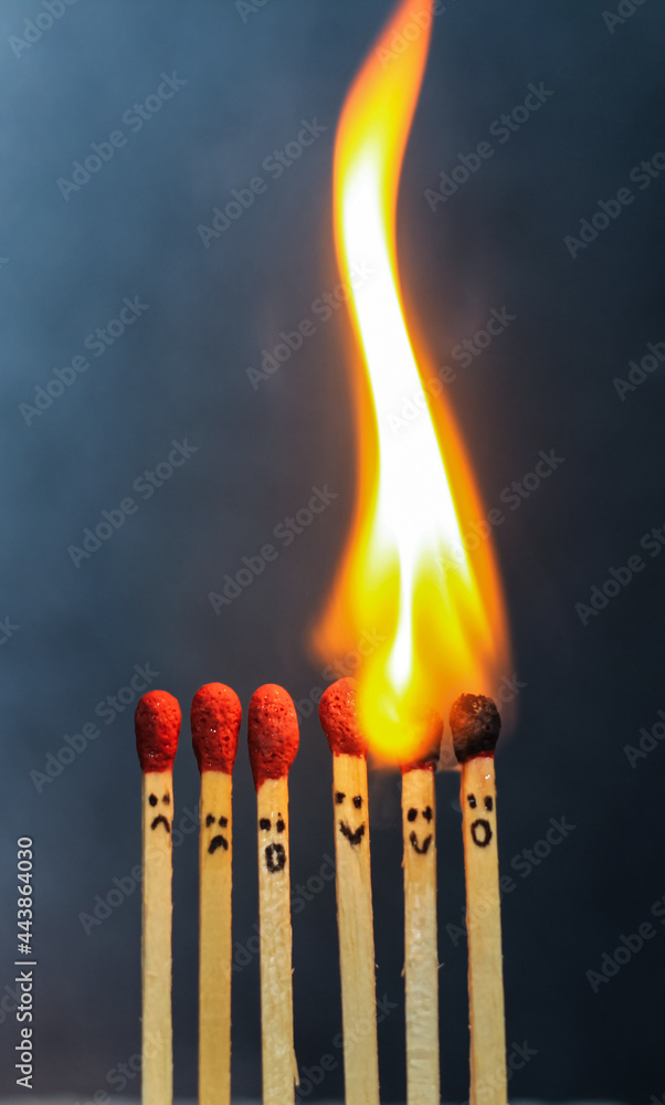 Group of a red match burning isolated with the background. Row burning matchstick in the chain reaction. Matchstick art photography. Group of a red match burning isolated with the background. Row burning matchstick in the chain reaction. Matchstick art photography.