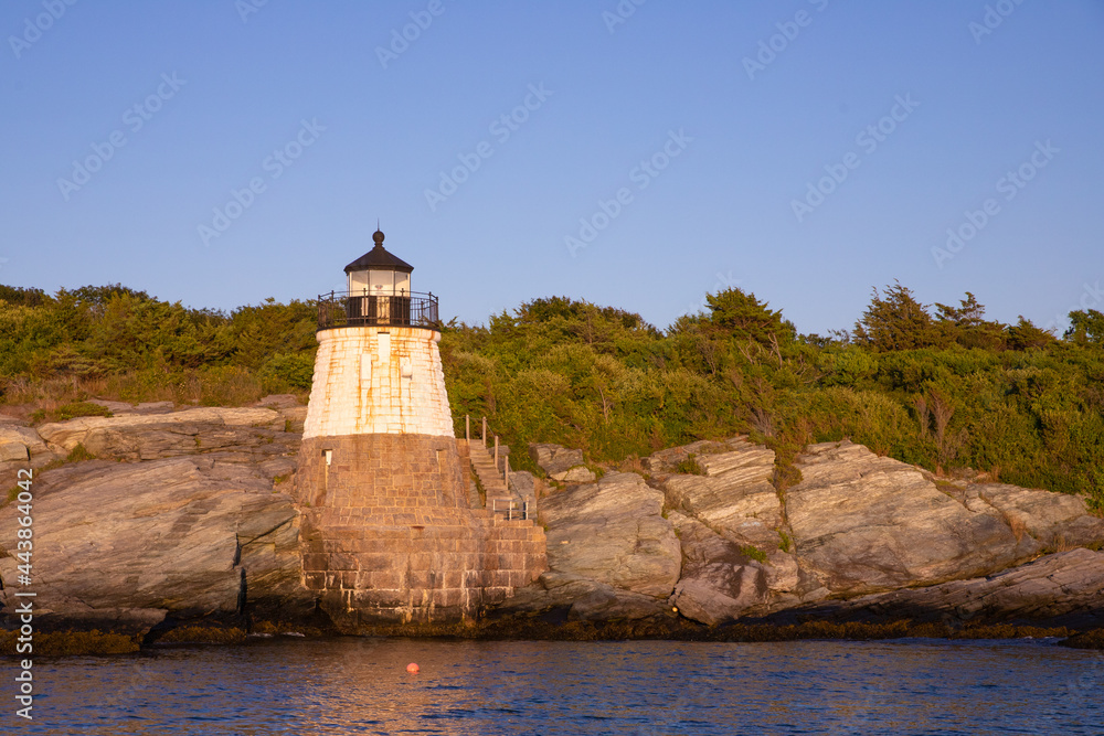 Beautiful Castle Hill Lighthouse seen of the coast of Newport Rhode Island on a sunny day Beautiful Castle Hill Lighthouse seen of the coast of Newport Rhode Island on a sunny day