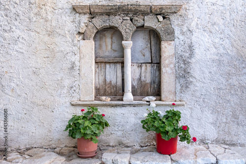 Folegandros island  Windows of an old church at Chora town square. Greece  Cyclades.