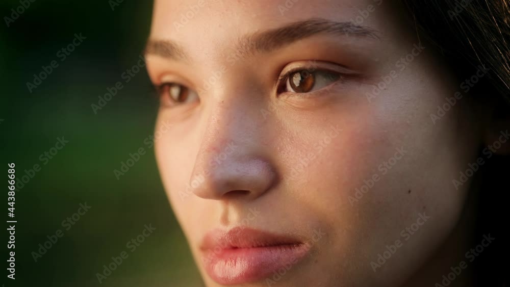 Eyes of wonderful asian young woman opening and looking straight. Beautiful face of chinese young pretty woman with black hair at sunny day. Ethnicity. Close-up Eyes of wonderful asian young woman opening and looking straight. Beautiful face of chinese young pretty woman with black hair at sunny day. Ethnicity. Close-up