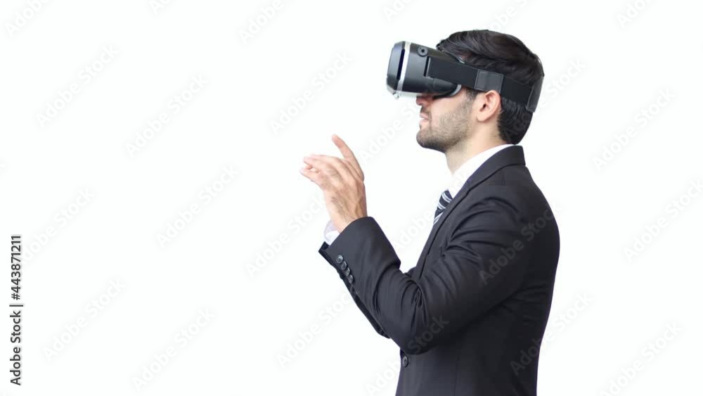 Businessman Wearing Professional Virtual Reality Headset Works and Gestures in Augmented Reality. Stylish Low Angle Arc Portrait Shot. Businessman Wearing Professional Virtual Reality Headset Works and Gestures in Augmented Reality. Stylish Low Angle Arc Portrait Shot.