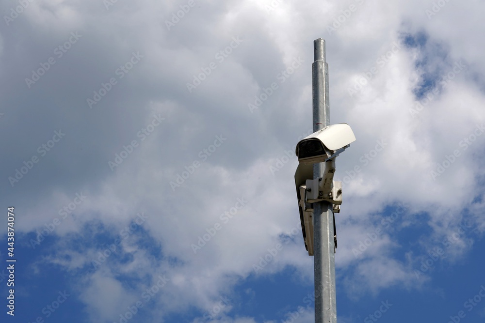 Cctv camera attached on a metal pole with sky on the background and a lot of copy space. It serves for protection of property for both private persons and copamanies. Cctv camera attached on a metal pole with sky on the background and a lot of copy space. It serves for protection of property for both private persons and copamanies.
