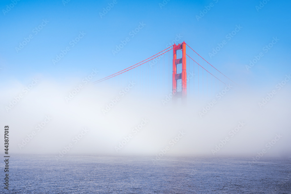 Golden Gate Bridge in the fog, photo taken from the embankment, San Francisco