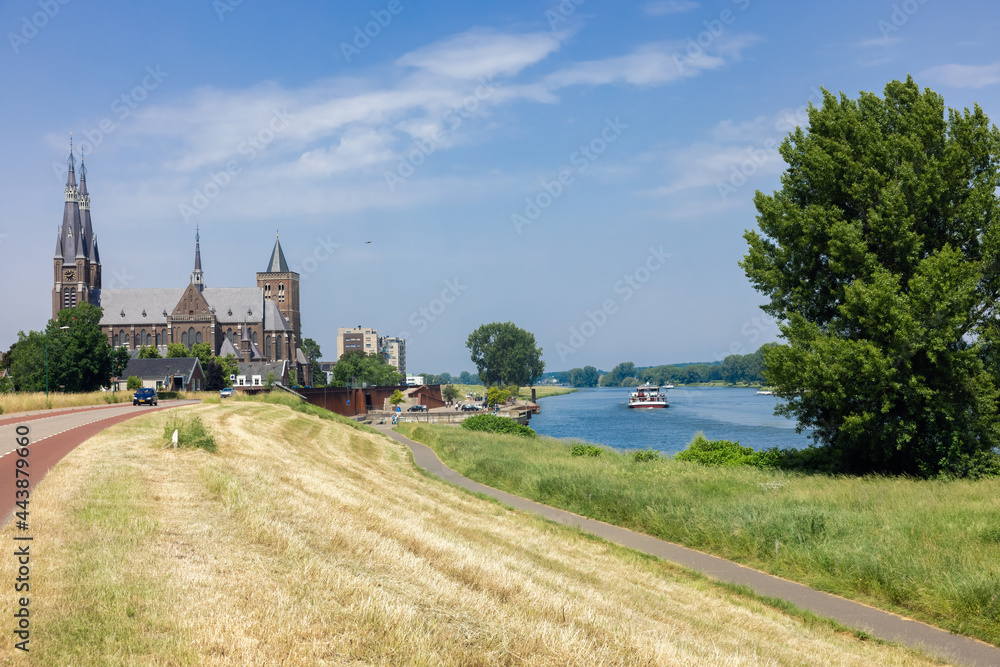 Dutch village Cuijk along river Meuse, view at Martinus church