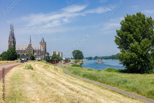 Dutch village Cuijk along river Meuse, view at Martinus church photo