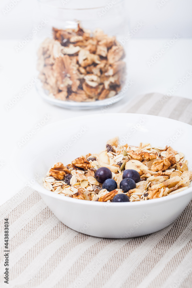 Homemade vegan granola cereal with soy yogurt, walnuts, blueberry and almond milk. Homemade vegan granola cereal with soy yogurt, walnuts, blueberry and almond milk.