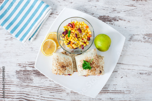 Traditional Mexican Food -  Burrito, on white wooden retro table