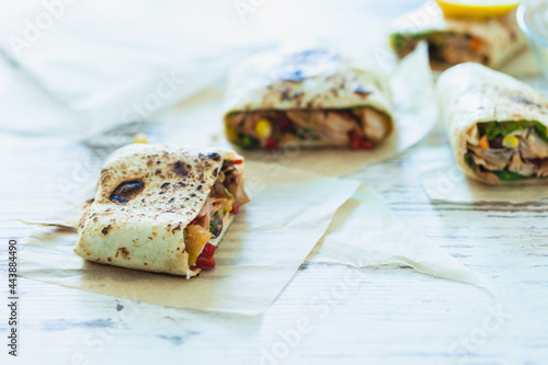 Traditional Mexican Food -  Burrito, on white wooden retro table