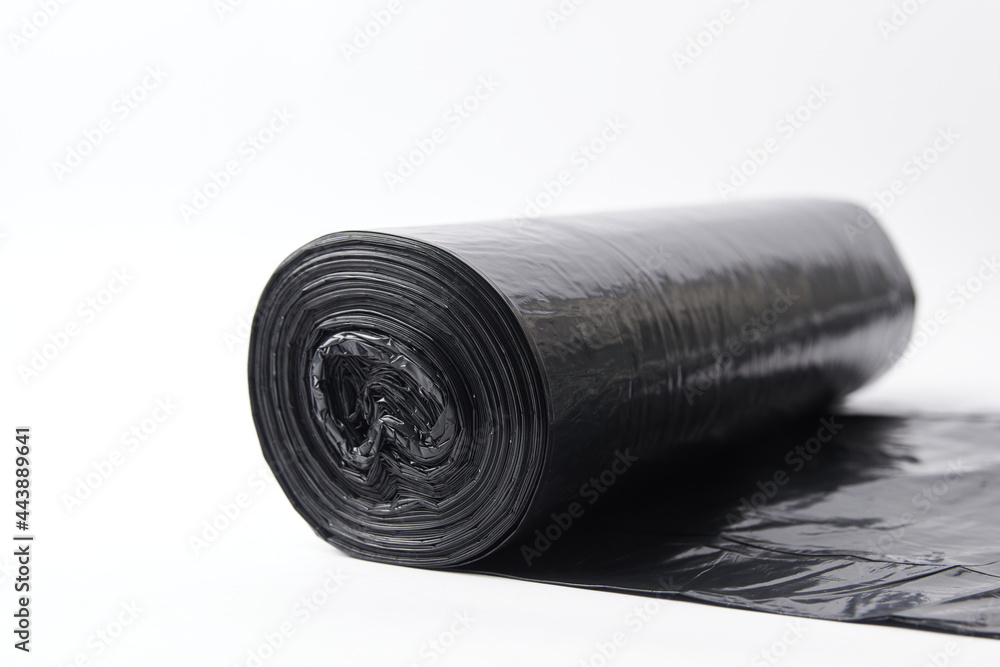 Garbage bag black isolated on white, disposable trash plastic used to dump junk Garbage bag black isolated on white, disposable trash plastic used to dump junk